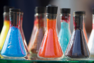 Glass flasks with colored powder