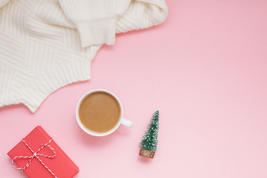 Coffee sweater and red present pink background