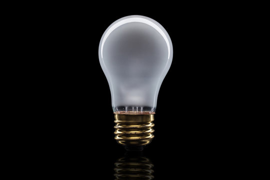 Light bulb on black background