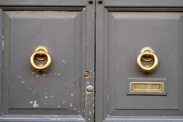 wooden door with knockers