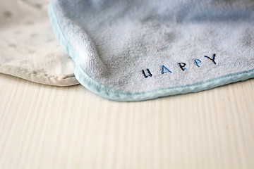 a baby bib on a white table