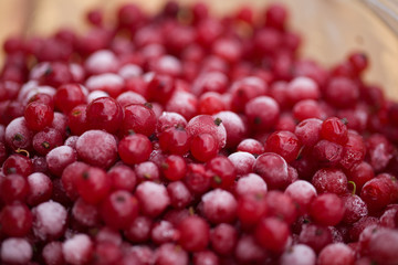 Frozen mixed berries as background. Currant mulberry texture pattern. Diet vegetarian food in winter.