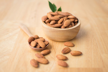almond on wooden table. soft focus.