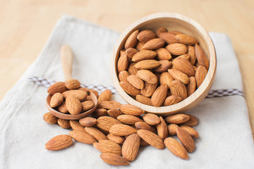 almond on wooden table. soft focus.