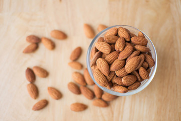 almond on wooden table. soft focus.