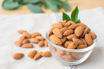 almond on wooden table. soft focus.