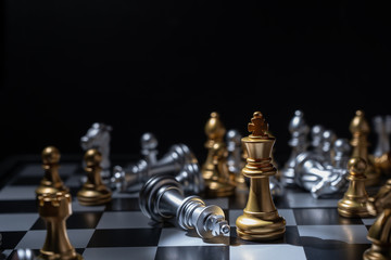 Chess board game for business concept in light and shadow.