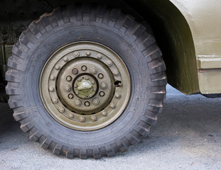 Fototapeta na wymiar Big rubber army lorry tyre