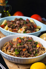 Beef spaghetti,There are plenty of tomatoes and chopped beef on it.