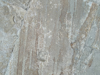 Natural textural gray grunge background. The old wall of the old castle