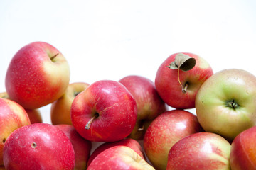 Bunch of red ripe apples on white background
