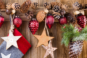 Christmas greeting card. Festive decoration on wooden background. New Year concept. Copy space.  Flat lay. Top view.