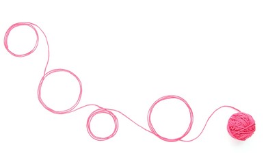 Abstract background with cotton thread circles and thread ball. Circles of pink thread isolated on white background.