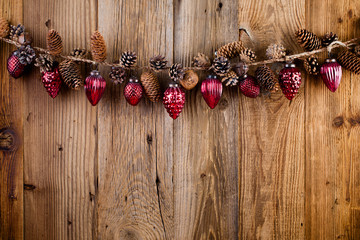 Christmas greeting card. Festive decoration on wooden background. New Year concept. Copy space.  Flat lay. Top view.