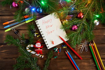 New Year in the office. Notepad with congratulations