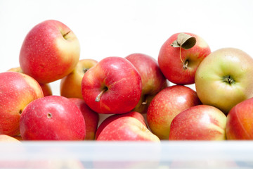 Bunch of red ripe apples on white background