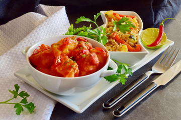 Chicken stew with pineapple and chili tomato sauce in a white bowl