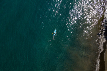 Canoe kayak paddling in French Polynesia Tahiti Island tropical paradise aerial view