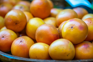Fresh oranges in local market. Selected close up focus.