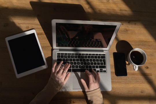 Executive using laptop in conference room at office