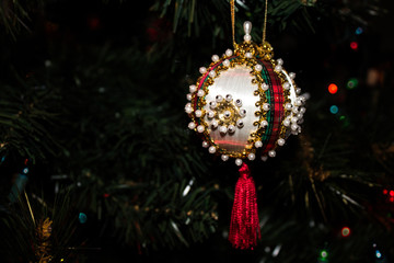 Festive Beaded Ornament on a Christmas Tree
