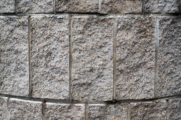 The surface of the rounded stone wall