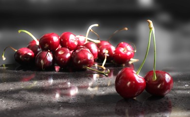 Red ripe cherry lying on the table