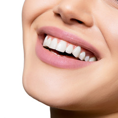 Smiling happy woman. Laughing female mouth with great teeth over white background. Healthy beautiful smile. Teeth health, whitening, prosthetics and care.