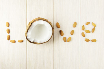Composition with coconut and almonds on the wood. - 233784833