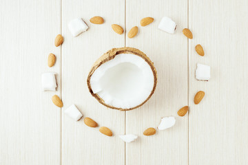 Composition with coconut and almonds on the wood. - 233784886