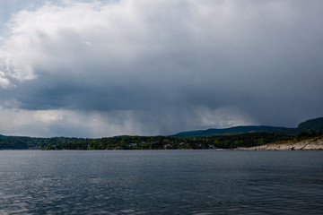 rocky coastline in Norway with few pine trees