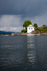 Fototapeta na wymiar rocky coastline in Norway with few pine trees