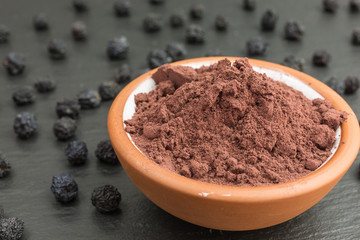 bowl of aronia berry powder