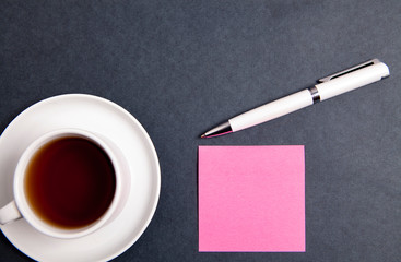coffee and paper in black background