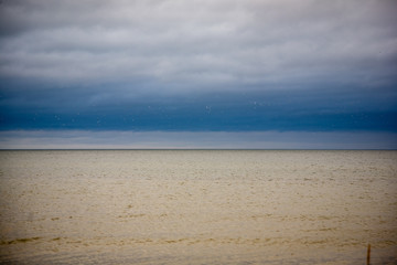 Obraz premium rocky coastline in Latvia with flow water in the sea and large rocks