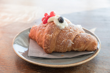 Creamy croissant with berries