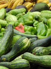 Close-up of some fresh vegetables and fruits: zucchini, peppers, cucumbers, avocados and bananas. Healthy and vegetarian food.
