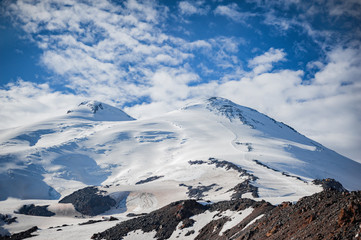 Fototapeta na wymiar The western and eastern peaks of Elbrus closeup