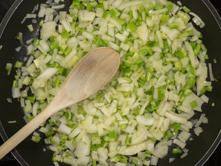onion and green pepper fried in a pan © jmag.foto
