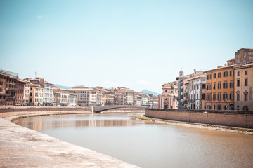 Fototapeta na wymiar River Arno which goes through famous italian town Pisa