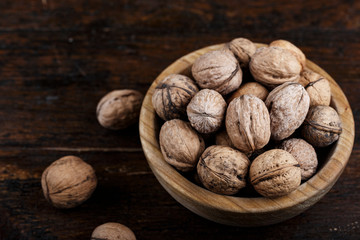 walnuts in a wooden plate