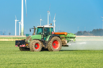 Tractor with fertilizer spreader in a corn field  |  8941
