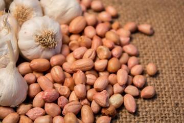 Group of Garlic and groun nuts on sackcloth for food.