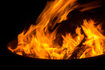 Beautiful flame with sparks in bonfire in the night. Heat and danger energy concept. Fire in...