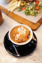 coffee latte art in a vintage coffee shop with vintage cup