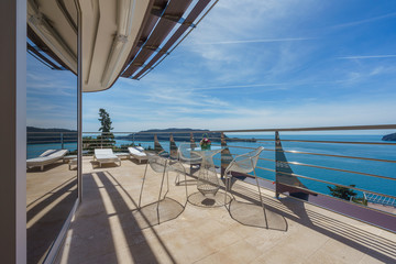 Fototapeta na wymiar Terrace of a luxury villa with a mountain and sea view