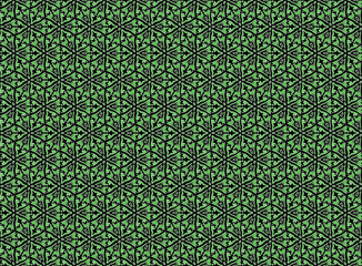 green stylized floral pattern on a black background
