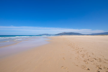landscape of seashore in beautiful sandy big and lonely beach Los Lances, in Tarifa, Cadiz, Andalusia, Spain