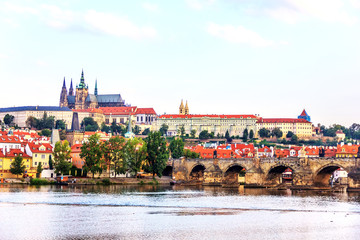 Charlse Bridge and Vltava river view with Prague Castle on the b