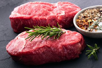 Two beef steaks with seasoning.Close-up